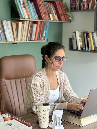 Ghazal working at her desk